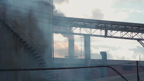 Factory expelling pollution and smoke through a chimney. Environmental problem Stock Footage 234831244