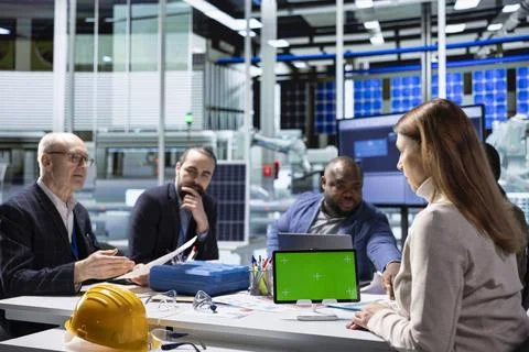 Factory experts uses mockup tablet to present research and development insights Stock Photos