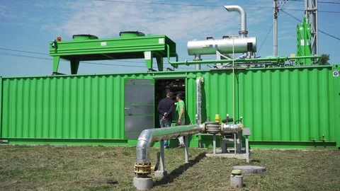 Factory Exterior View of Green Container and Metal Pipes and Industrial Devices Stock Footage 108629171