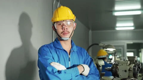 The factory foreman confidently crosses his arms, smart concept. Stock Footage 140276332