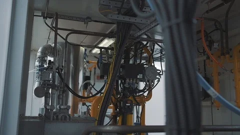 Factory industrial compartment with many cables and pipes Stock Footage 125881028