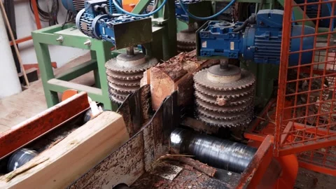 Factory of industrial wood. Separation of logs on a special machine. Production Stock Footage 201136643