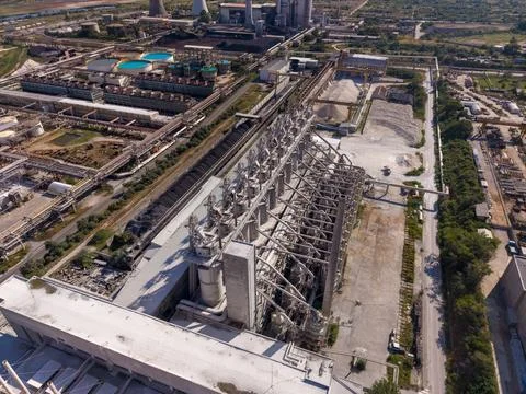 Factory with large structures and machinery in an industrial area Stock Photos