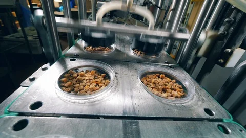 Factory machine is covering bread crumbs with foil. Packing process at factory. Stock Footage 115106080