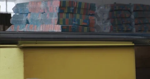 Factory machine cuts foam sponge blanks, kitchen sponges, creating desired shape 動画素材 128786818