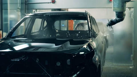 Factory machine is spraying zinc over a carcass of a car Video stock 142784522