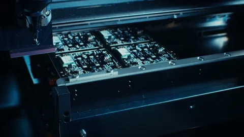 Factory Machine at Work: Electronic PCB Being Assembled with Automated CNC Robot Stockbeeldmateriaal 98188649