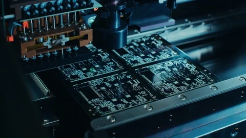 Factory Machinery at Work Printed Circuit Board Being Assembled with Robotic Arm Stock Footage 98190153