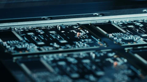 Factory Machinery at Work Printed Circuit Board Being Assembled with Robotic Arm Stock Footage 98190605
