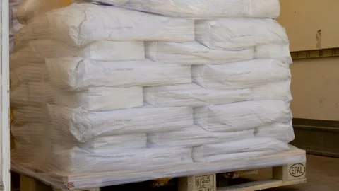 Factory Man Is Loading Cardboard Boxes On A Hand Pallet Truck In Warehouse Vi Stock Footage 276760437