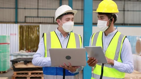 Factory manager and engineer in  medical mask and safety protective working Stock Footage 158469153