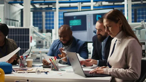 Factory manager looking over paperwork files, developing business model Stock Footage 306106477