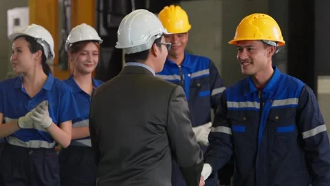Factory Manager Shaking Hands with Industrial Worker in Factory. Stock Footage 343428708