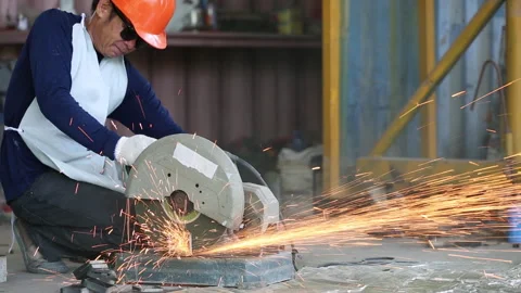 Factory mechanics are using Fiber cutting platform tools to cut steel for c.. Stock Footage 336942668