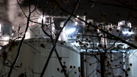 Factory at night - bright light and smoke Stock Footage 152849540