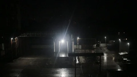Factory in night light raining technology construction city industrial industry Stock Footage 96123494