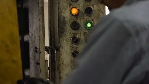 Factory Operator Closing Door Presses Button On Dirty Control Panel Stock-Footage 122106067