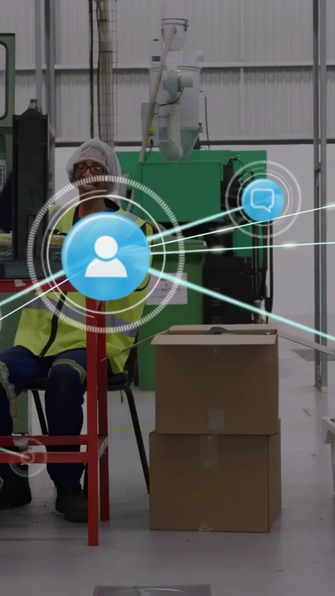 Factory operator leaning, gesturing as blue icon growing into nodes over him Stock Footage 331215849