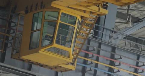 Factory Overhead Crane With Worker In Pilot Cabin (4K) Stock Footage 60768506