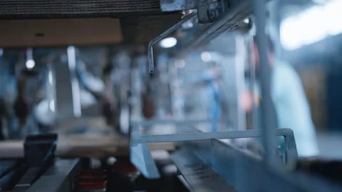 Factory packing cardboard machine working automated conveyor line close up Stock Footage 169876999