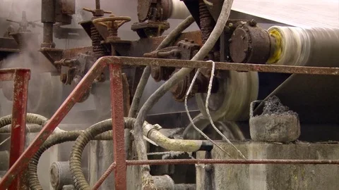 Factory. Papermaking. Sheet of Raw Paper Moving on Conveyer Through Rolls. Stock Footage 72079151