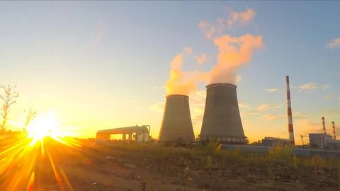 Factory pipes at summer sunset timelapse Stockbeeldmateriaal 81606145