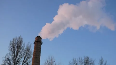 Factory pipes with thick white smoke polluting environment in blue sky back.. Stock Footage 248304347
