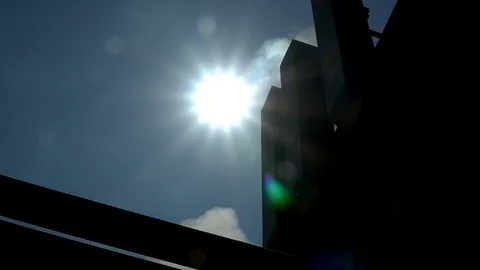 Factory polluting air without a filtration system, sun flare Stock Footage 116746285