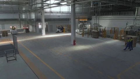 Factory premises. Plant. A loading machine carries products. Stock Footage 108425658