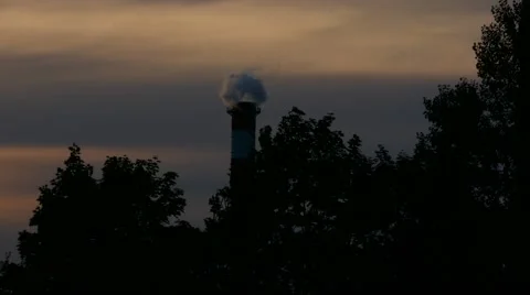 Factory producing pollution &amp; smoke in middle of trees - global warming concept Stock Footage 67895165
