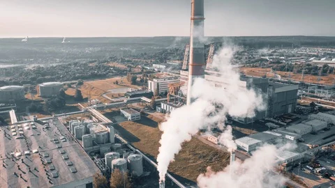 Factory producing smoke. Air pollution, industry impact on environment. Aerial Stock Footage 113457262