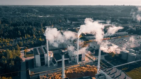Factory producing smoke. Air pollution, industry impact on environment. Aerial Video stock 113457290