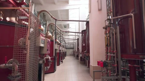 Factory production of brandy. Large tanks of stainless steel and copper Video stock 131235012