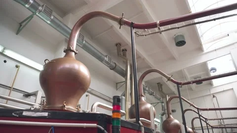 Factory production of brandy. Large tanks of stainless steel and copper Stock Footage 131235050