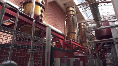 Factory production of brandy. Large tanks of stainless steel and copper Stock Footage 151895675