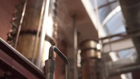 Factory production of brandy. Tanks and tanks of stainless steel and copper Video stock 105870033