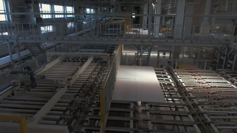 Factory production line. A worker works in a factory. Drywall production. Stock Footage 123060189