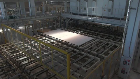 Factory production line. A worker works in a factory. Drywall production. Stock Footage 123060210