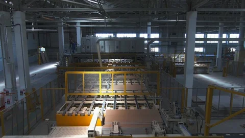 Factory production line. A worker works in a factory. Drywall production. Stock Footage 123063245