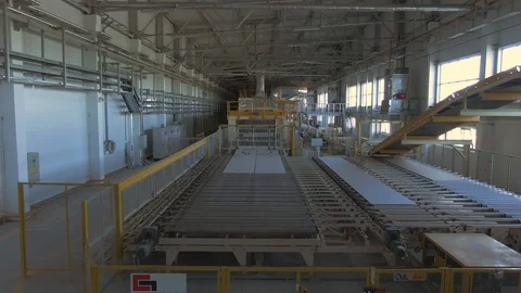 Factory production line. A worker works in a factory. Drywall production. Stock Footage 123063308