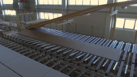 Factory production line. A worker works in a factory. Drywall production. Stock Footage 123063334