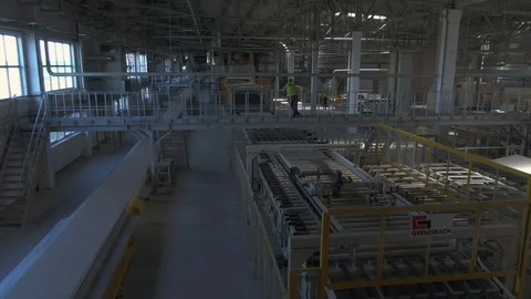 Factory production line. A worker works in a factory. Drywall production. Stock Footage 123063373