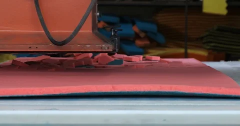 Factory production, press cuts foam blank of red into flat hexagonal sponges Stock Footage 128635545