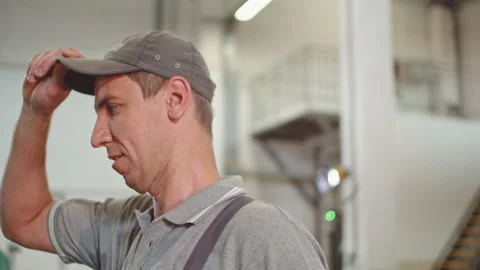 Factory Production Worker Putting on a Cap Stock Footage 197114630
