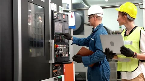 Factory Professional worker and manager inspector on heavy machine. Stock Footage 138610749