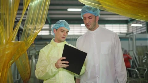 Factory Professionals in Discussion Video stock 332891833