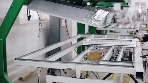 Factory for PVC windows and doors production. Workers in workshop. Vídeo Stock 129366724