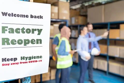 Factory reopen signage after COVID-19 pandemic Stock Photos