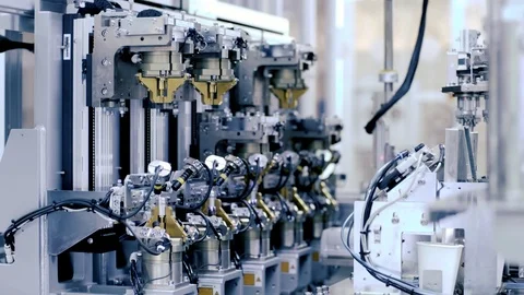 Factory robotic arm tech in Manufacturing Line Assembling Product Stock Footage