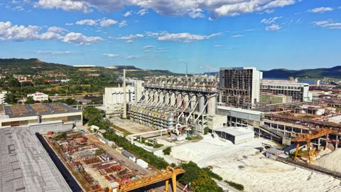 Factory site during day with machinery and structures visible in the background Stock Footage 341582418
